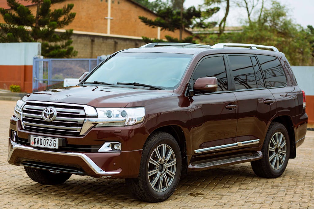A Toyota Land Cruiser parked in an urban area, showcasing its sleek design.